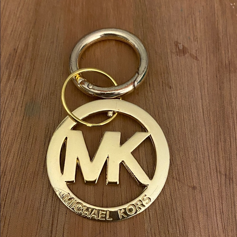 Michael Kors bag charm in good condition